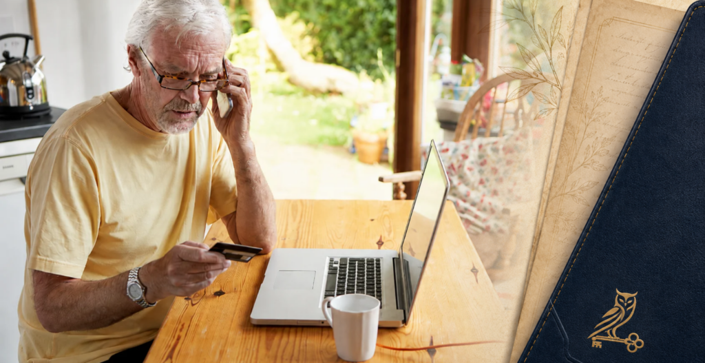 Older man on the phone with a credit card and laptop, suggesting uncharacteristic money decisions online.